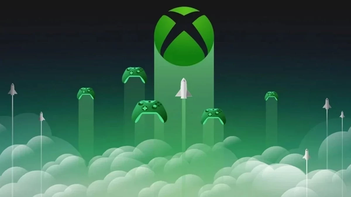 Bulutların üzerinde Xbox logosu ve farklı oyun kumandaları